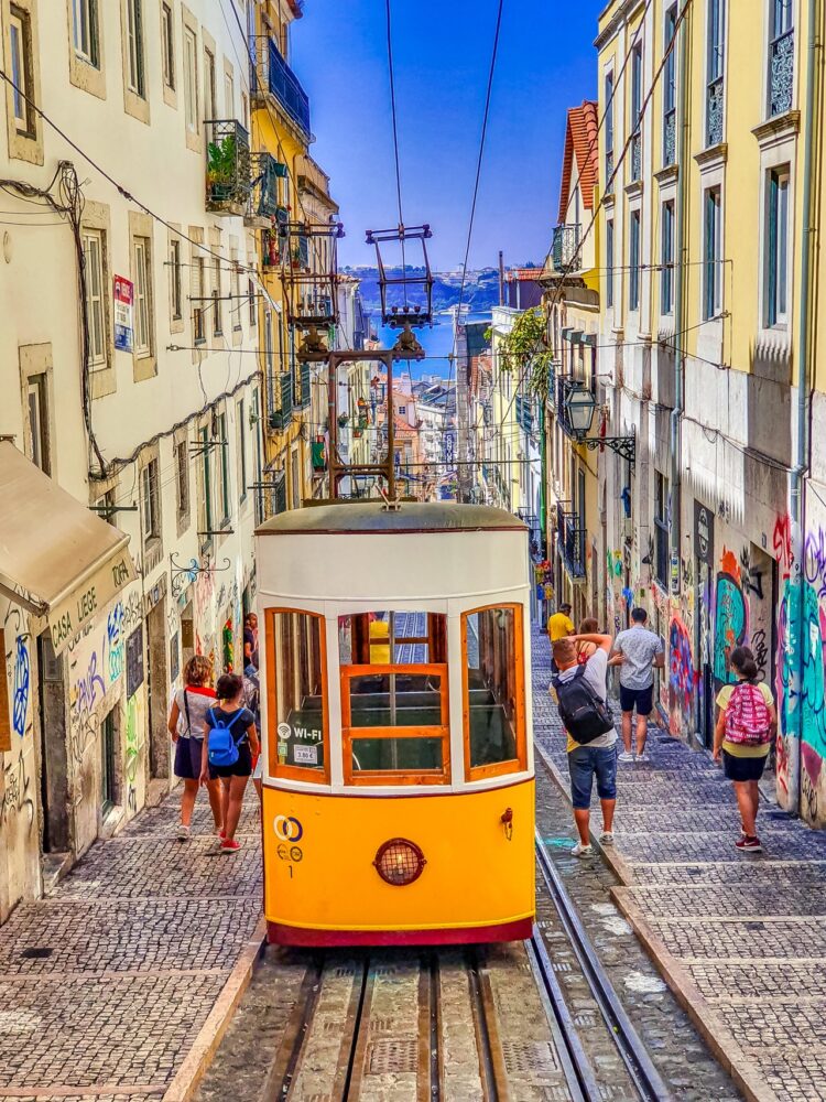 People walking on street near yellow tram 3780224