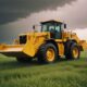 Powerful wheel loader bulldozer on white background