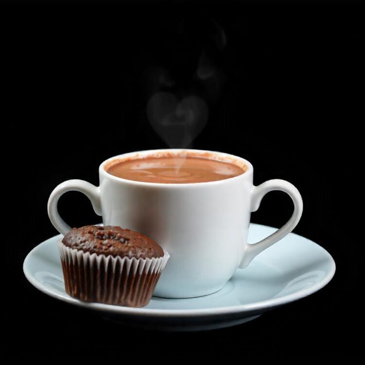 Steaming cup of hot chocolate with a cookie C Hot Drink Photos