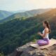Practicing meditation and zen energy yoga in the morning in the mountains